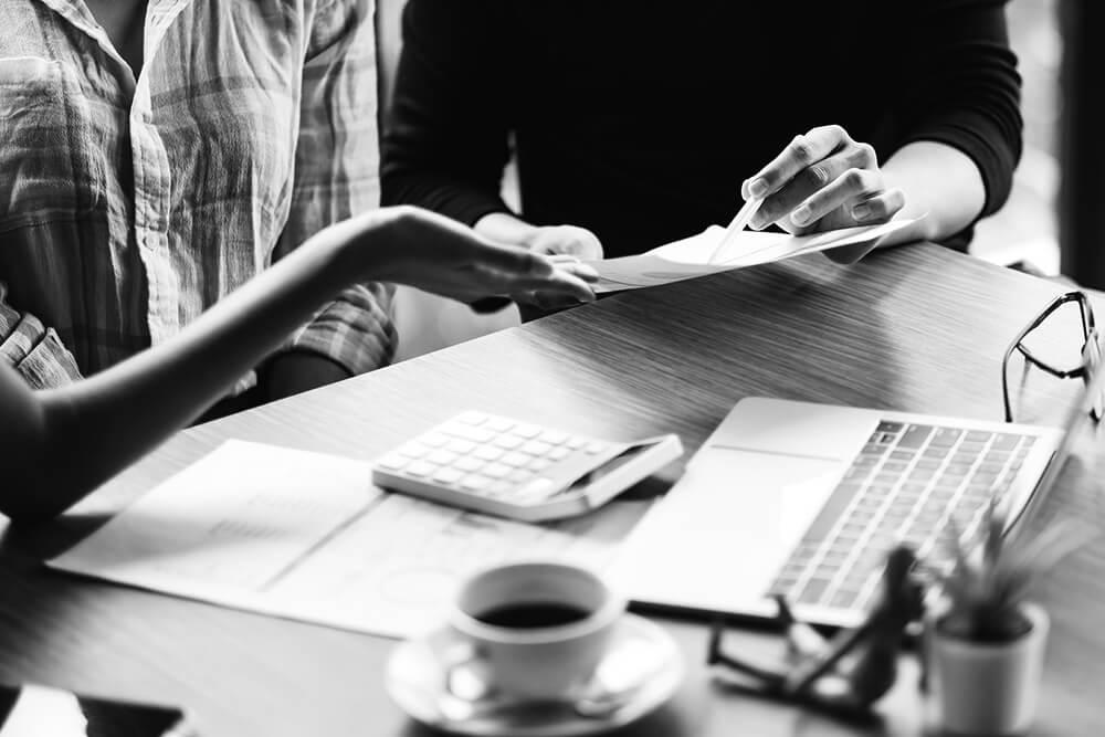 two people reviewing paperwork